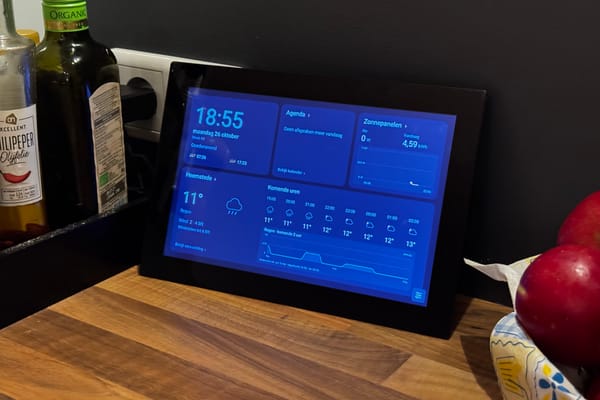A Denver Android photo frame displaying the FrameDash home dashboard on a kitchen counter